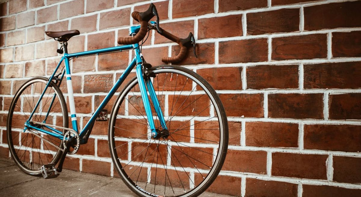 Picture of a bike resting against a wall